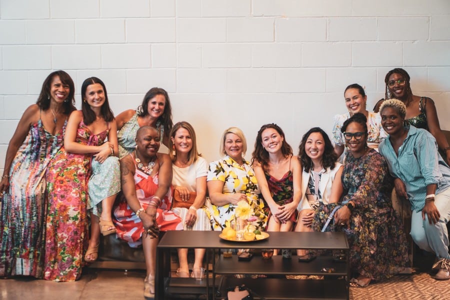 Women Founders, multi-cultural, sitting on a couch at The LOLA who need your support!